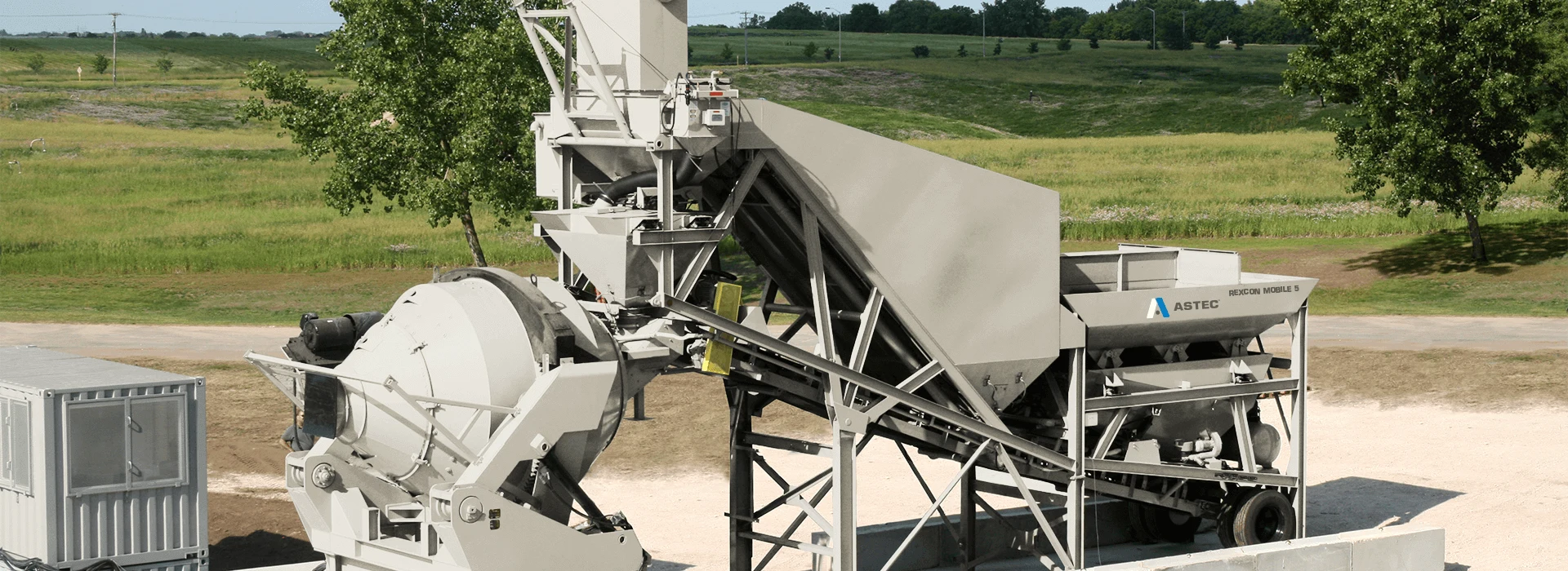 RexCon Mobile 5 portable concrete batch plant with central mixer and aggregate bins